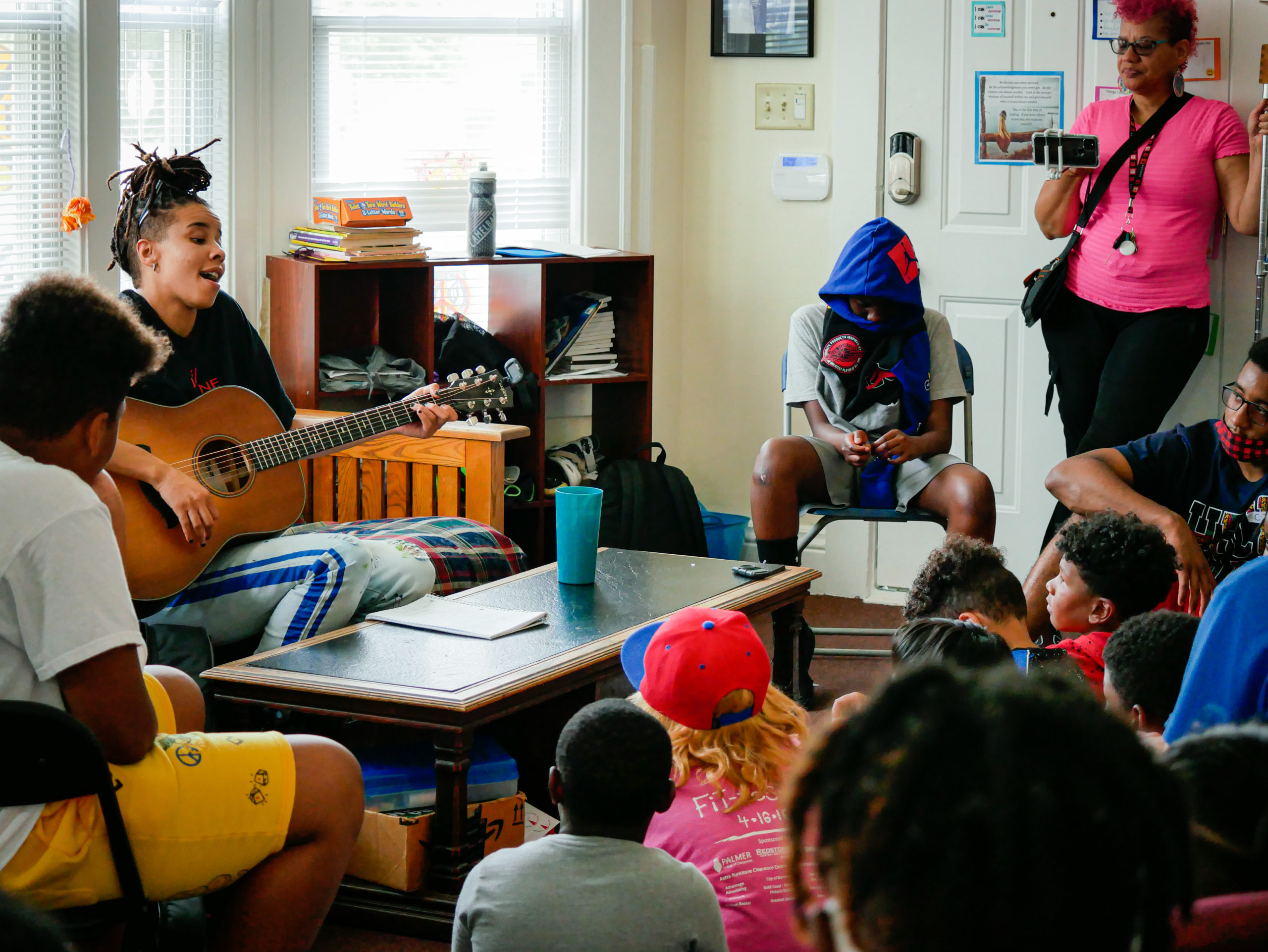 Juno performs for children in the Project Renewal and River Music Experience collaborative project.