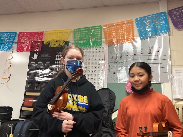 Emma Noah, left, a Glenview 8th grader, and Rebecca Nung, a 7th grader, both play violin in separate mariachi groups.